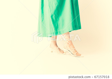 Women's feet wearing sandals Women's feet wearing sandals 67157018