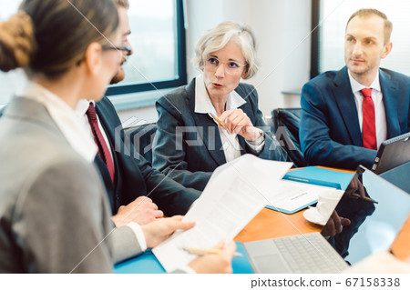 Experienced attorney with her team of professionals working Experienced attorney with her team of professionals working 67158338