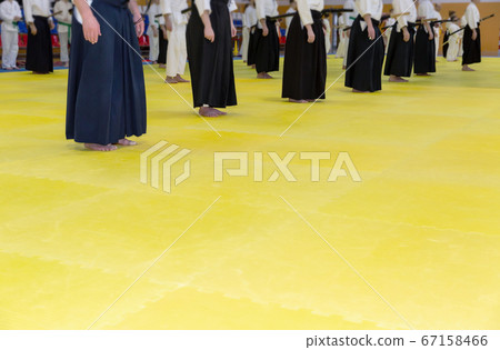 People in kimono on martial arts weapon training seminar People in kimono on martial arts weapon training seminar 67158466