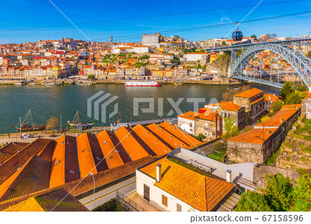 Cityscape of Porto with Dom Luis I Bridge, old architecture and cable car, Portugal 67158596