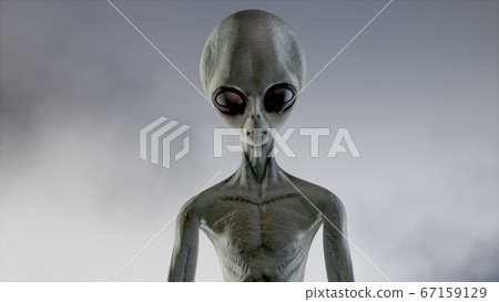 Scary gray alien walks and looks blinking on a Scary gray alien walks and looks blinking on a 67159129