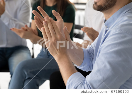 People sit on chairs clapping hands close up image People sit on chairs clapping hands close up image 67160103