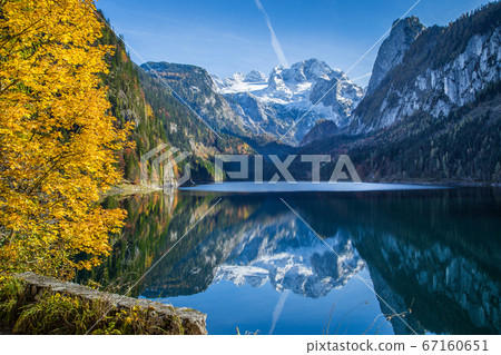 Autumn scenery with Dachstein mountain at sunrise in fall 67160651