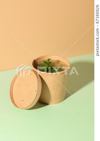 Healthy chicken broth on brown paper. Healthy chicken broth on brown paper. 67160826