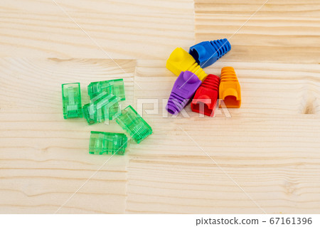 set cable rj 45 and cap red blue, red on a wooden 67161396