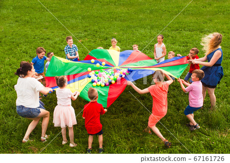Kids in a circle playing social game 67161726