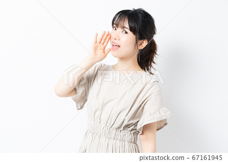 Young woman calling out aloud Young woman calling out aloud 67161945