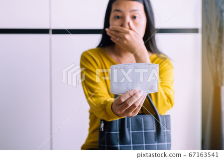Asian woman using fillter mask protect PM 2.5 because pollution in home,Stay at home,Work from home Asian woman using fillter mask protect PM 2.5 because pollution in home,Stay at home,Work from home 67163541
