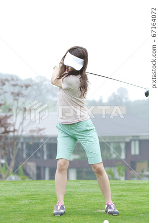 Women playing golf Women playing golf 67164072