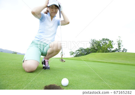 Women playing golf Women playing golf 67165282