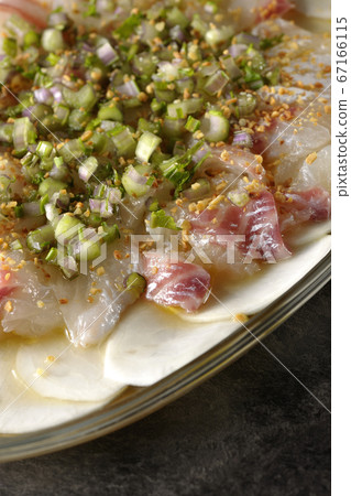 Carpaccio of sea bream and turnips on a transparent flat plate 67166115