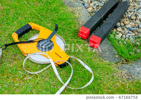 Image of land boundary pile surveying 67168758