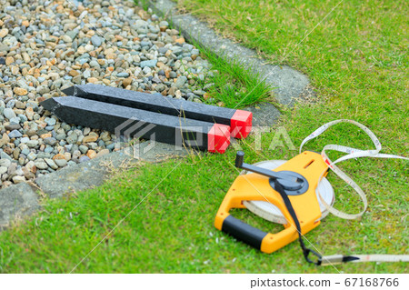 Image of land boundary pile surveying Image of land boundary pile surveying 67168766