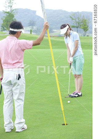 Men and women playing golf Men and women playing golf 67168810