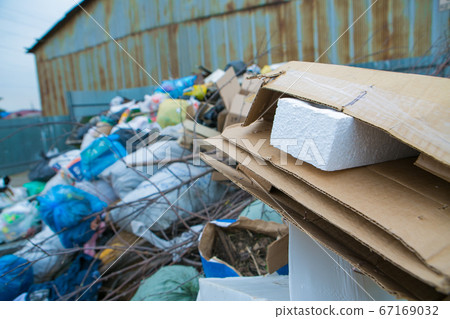 pile of waste in a container. garbage collapse. Janitors ' strike. environmental disaster of plastic recycling 67169032