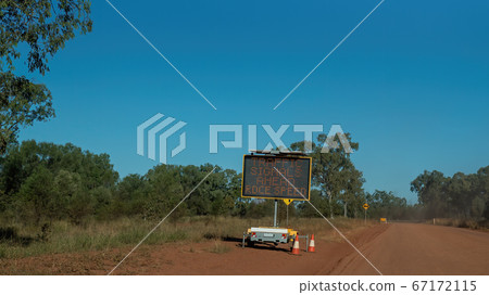 Traffic Sign On Rough Dirt Australian Outback Road 67172115