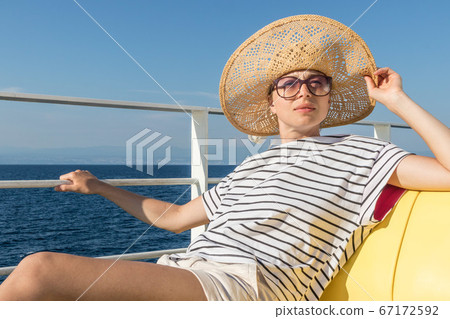 Beautiful, romantic blonde woman taking selfie self portrait photo on summer vacations traveling by cruse ship ferry boat. Beautiful, romantic blonde woman taking selfie self portrait photo on summer vacations traveling by cruse ship ferry boat. 67172592