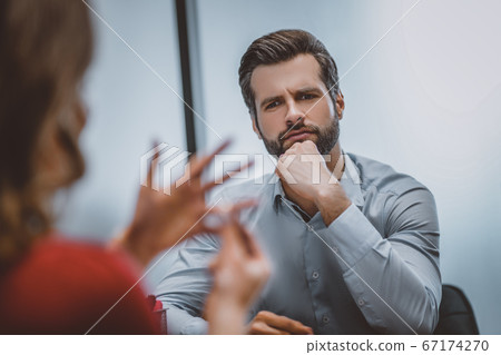 Man looking at his ex with regret 67174270
