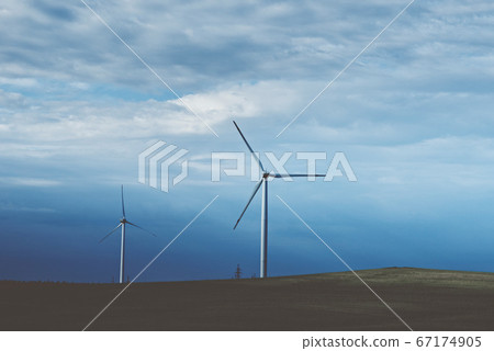 Wind turbine in the field, toned photo. Wind power 67174905