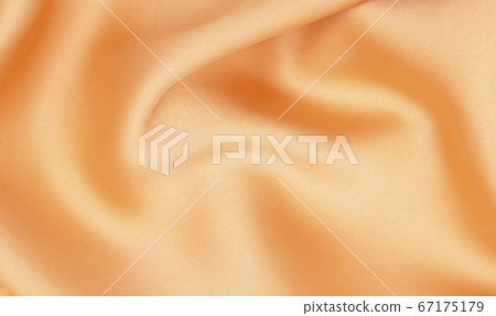 Fabric golden in natural silk. Peach smooth silk fabric. Fabric golden in natural silk. Peach smooth silk fabric. 67175179