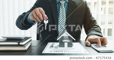 Hand a real estate agent, hold the keys, and explain the business contract, rent, buy, mortgage, loan, or home insurance Hand a real estate agent, hold the keys, and explain the business contract, rent, buy, mortgage, loan, or home insurance 67175438