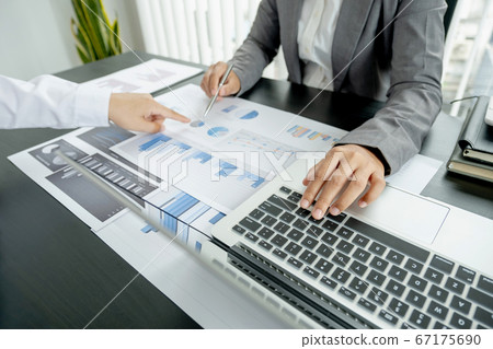 businessmen and businesswomen team pointing to charts meeting to plan strategies to increase business income. Have a brainstorming graph analysis and discussing for the new target success 67175690
