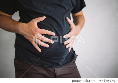 Overweight man with excess belly fat, copy space 67176575