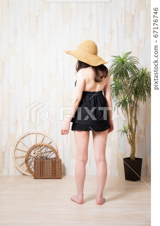 A woman in a bathing suit 67176746