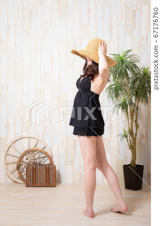 A woman in a bathing suit A woman in a bathing suit 67176760