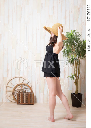 A woman in a bathing suit A woman in a bathing suit 67176761