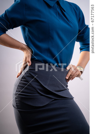 Body shape of woman in blue shirt posing showing Body shape of woman in blue shirt posing showing 67177563