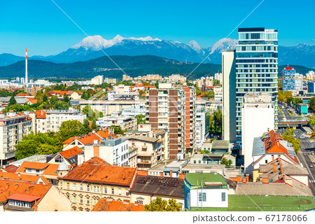 Panorama of Ljubljana with modern architecture and the beautiful Alps on the background Panorama of Ljubljana with modern architecture and the beautiful Alps on the background 67178066