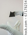 Man holds rubber gloves black face masks 67178254