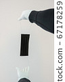 Man holds rubber gloves black face masks 67178259