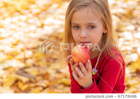 cute baby eating an apple cute baby eating an apple 67178486