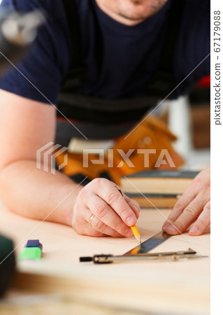 Arms of worker making structure plan Arms of worker making structure plan 67179088