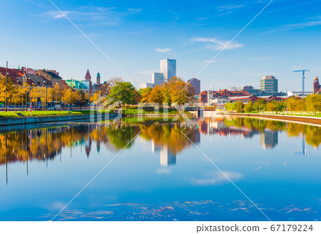 Malmo, Sweden: skyline reflected in the water, urban landscape panorama Malmo, Sweden: skyline reflected in the water, urban landscape panorama 67179224