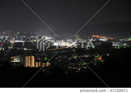 Night view of Mihara City, Hiroshima Prefecture, light trace of Sanyo Shinkansen in the center of the screen Night view of Mihara City, Hiroshima Prefecture, light trace of Sanyo Shinkansen in the center of the screen 67180671