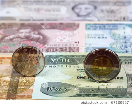Ethiopian coin on the background of money 67180967