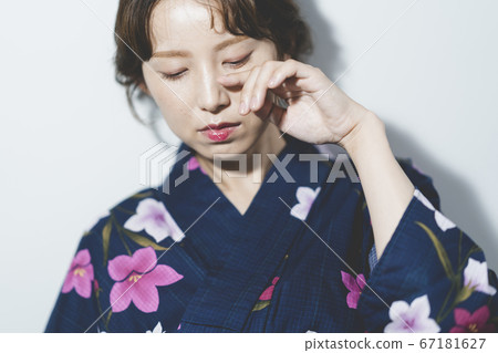 A woman in a yukata A woman in a yukata 67181627