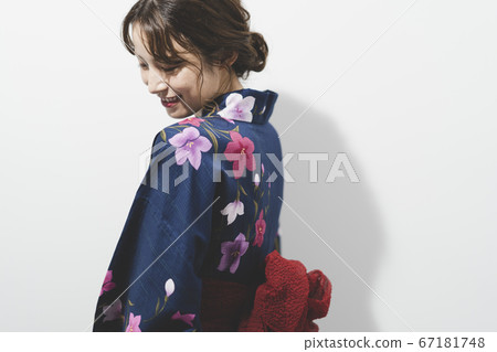 A woman in a yukata A woman in a yukata 67181748