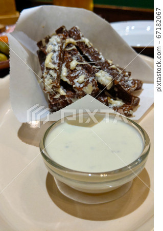 Hot croutons with beer sauce. Selective focus. 67182067