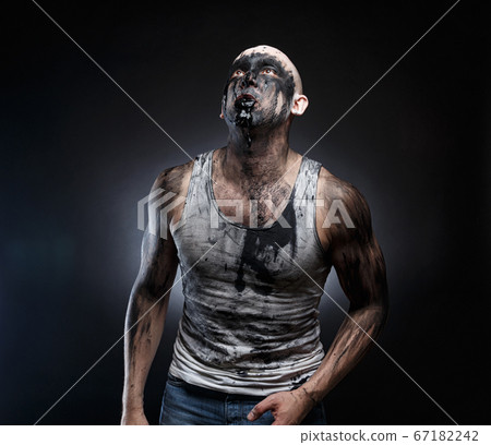 Image of bald man with black goo in the mouth 67182242