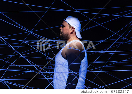 Photo of fat man in white threads in neon light Photo of fat man in white threads in neon light 67182347