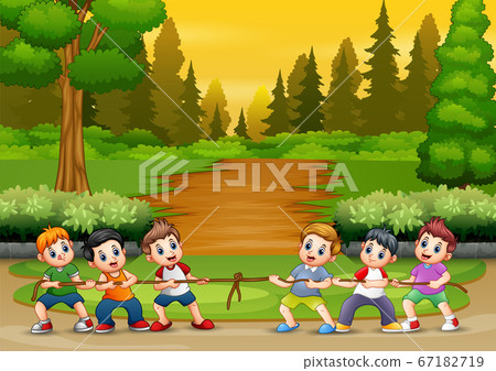 Group of boys playing tug of war in the park Group of boys playing tug of war in the park 67182719