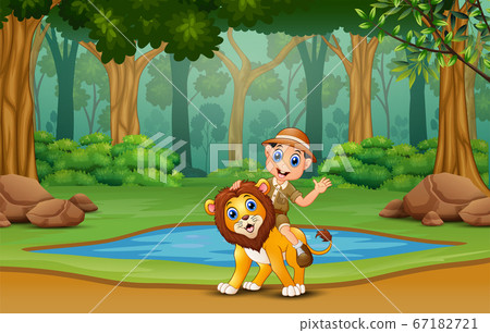 A safari boy with lion in the jungle A safari boy with lion in the jungle 67182721