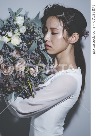 Bride wearing a wedding dress Bride wearing a wedding dress 67182873