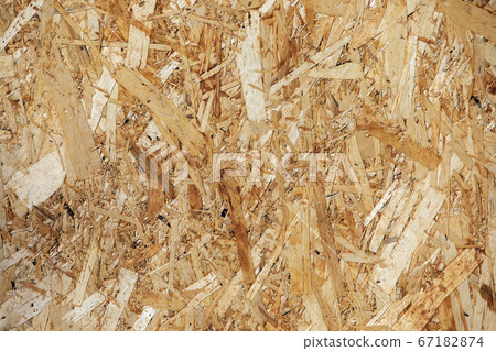 Pressed wooden panel background. OSB wood board. Pressed wooden panel background. OSB wood board. 67182874