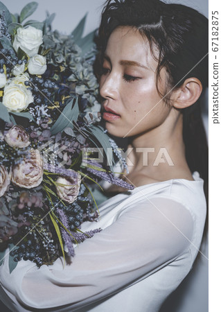 Bride wearing a wedding dress Bride wearing a wedding dress 67182875