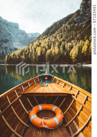 Traditional rowing boat at Lago di Braies in the Dolomites, South Tyrol, Italy 67183491